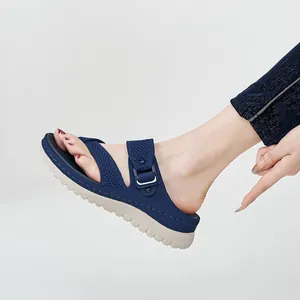 Women's sporty blue knit hollow-out platform sandals with adjustable buckle strap.