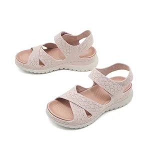 Detail shot of pink knit wedge sandals with velcro strap and thick comfort sole