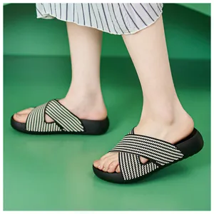 Detail view of stylish thick-sole sandals with black and white zigzag fabric straps