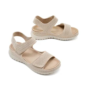 Comfortable beige mesh sports sandals with adjustable velcro straps and thick platform soles
