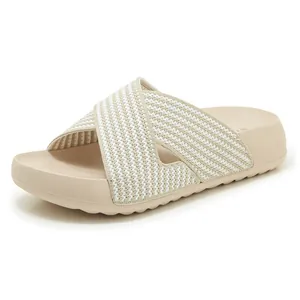 Detailed view of women's beige breathable knit cross-strap platform slippers for summer