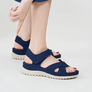 Women's navy blue sport sandals with thick beige platform sole and magic tape straps