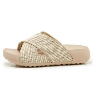 Detailed side view of beige platform slide sandals featuring cross knit woven straps