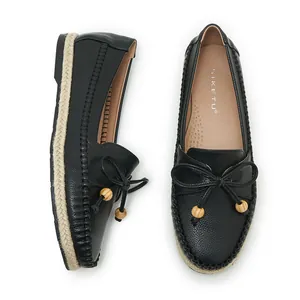 Black women's casual soft sole loafers with decorative bow and straw-woven sole edge.
