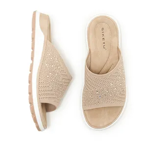 Detailed top and side view of beige knitted rhinestone flat sandals for ladies