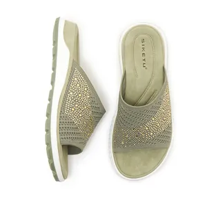 Top and side view of comfortable olive green fly-knit slippers with sparkling rhinestones