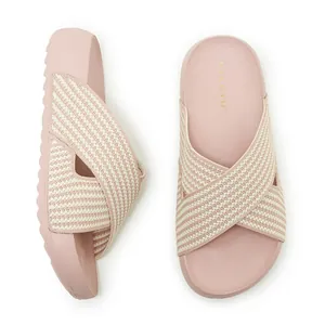 Top and side view of pink platform slide sandals featuring beige textured fabric cross straps