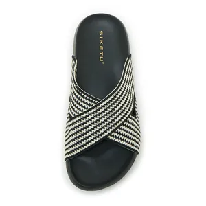 Top view detail of SIKETU black and white patterned cross-strap platform slide sandal