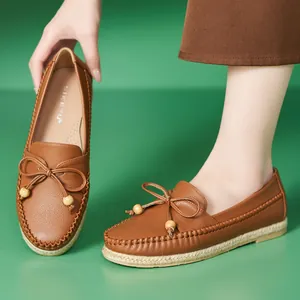 Comfortable brown leather loafers for women with decorative bow and soft non-slip sole