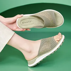 Comfortable women's olive green knitted slide sandals with rhinestone accents and flat sole