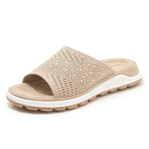 Elegant beige knit flat slides for women featuring sparkly rhinestone details on white background