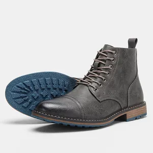 Bottines Martin grises pour hommes avec cuir texturé et semelle en caoutchouc bleu