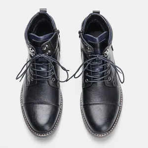 Vue de dessus de bottines Martin vintage en cuir noir avec fermeture éclair latérale