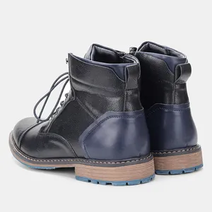 Rear detail of vintage men's Martin boots with blue contrast heel and side zipper.