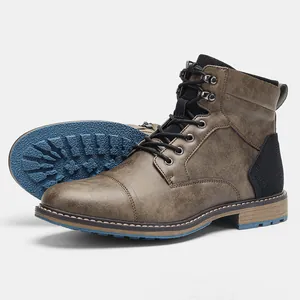 Close-up of vintage brown men's Martin boots showing detailed side view and blue sole
