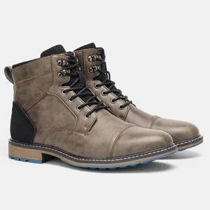 Detailed side view of large size distressed leather vintage brown men's Martin work boots.