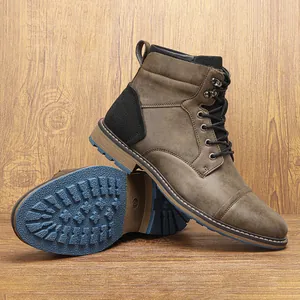 Close-up of vintage brown men's Martin boots with blue anti-slip rubber sole detail