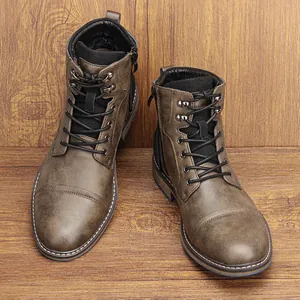 Vintage brown leather men's Martin boots with side zipper and classic cap-toe design