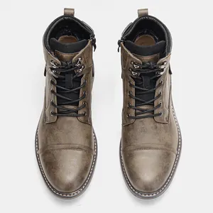 Overhead detail view of vintage brown men's Martin boots featuring distressed leather texture