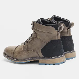 Side view of vintage burnished men's Martin boots with lace-up and zipper details