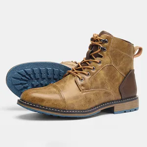Detailed view of vintage men's work boots showing brown leather texture and blue sole