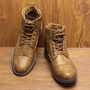 Close-up of vintage distressed brown leather Martin boots for men with side zipper