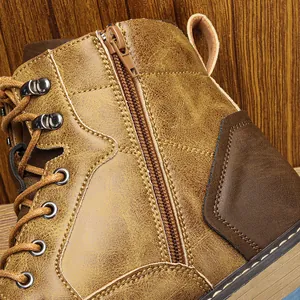 Detailed close-up of side zipper and vintage rubbed leather on men's Martin boots