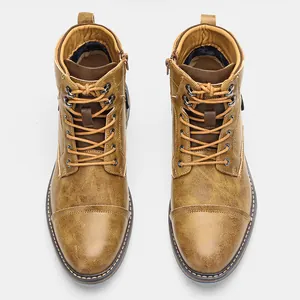 Top-down view of vintage brown men's Martin boots showing distressed leather texture