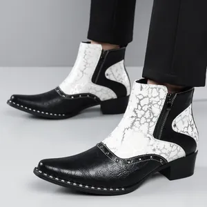 Detail of black and white crackle pattern men's Chelsea boots with side zipper and studs