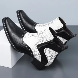 Men's British Chelsea boots with black and white crackle pattern and silver studs detail.