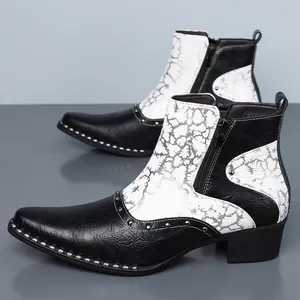 Detailed view of men's British style Chelsea boots with cracked leather and rivets