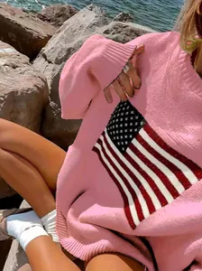 Detail view of pink knit sweater featuring American flag star and stripe pattern.