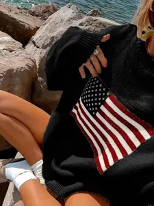 Macro detail of vintage black oversized knit sweater featuring a patriotic American flag design