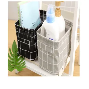 Detail of black and grey grid fabric storage baskets with handles for home organizing