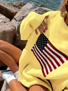 Close-up view of a yellow oversized knitted sweater featuring a retro American flag pattern