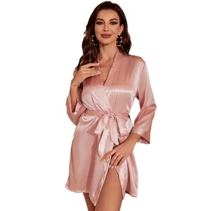 Elegant light pink satin bathrobe for women featuring an adjustable tie-waist closure