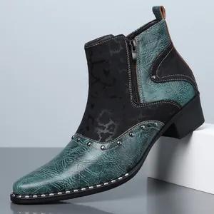 Close-up of men's two-tone Chelsea boot with vintage texture and silver studs