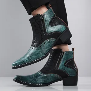 Close-up of stylish men's teal and black Chelsea boots with silver studded accents