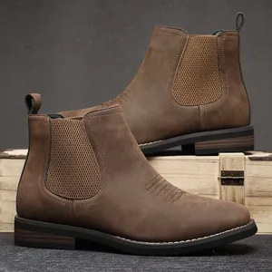 Detail view of brown matte leather Chelsea boots for men with elastic side panels.