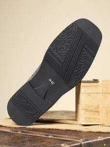 Detailed view of the durable anti-slip rubber sole on premium men's leather Chelsea boots