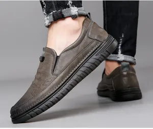 Close-up detail of stylish men's brown leather slip-on shoes with durable non-slip soles