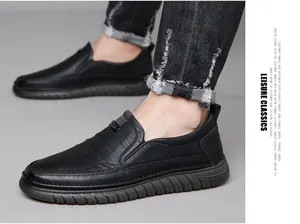 Detail shot of men's black leather slip-on shoes featuring a durable anti-slip rubber sole