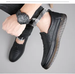Detail of men's non-slip black leather loafers with slip-on design for casual wear.