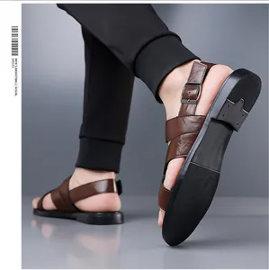 Close-up of men's brown leather sandals with adjustable buckles and non-slip soles