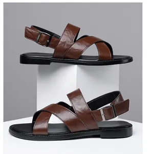 Men's brown faux leather cross-strap sandals featuring a durable flat sole and buckle detail