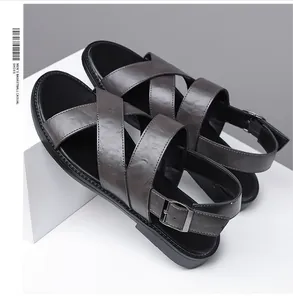 Side view of dark grey leather men's sandals featuring adjustable heel buckle straps