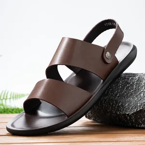 Side detail of brown men's leather sandals with adjustable backstrap and soft sole.