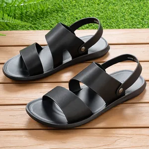 Detailed view of black men's dual-use beach sandals on a wooden deck