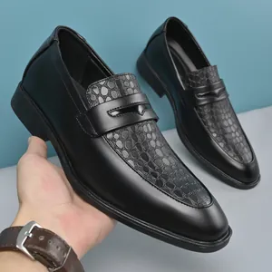 Macro view of men's black leather loafers with scale pattern in British business style