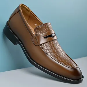 Detailed side view of men's brown leather loafers with stylish embossed pattern texture.